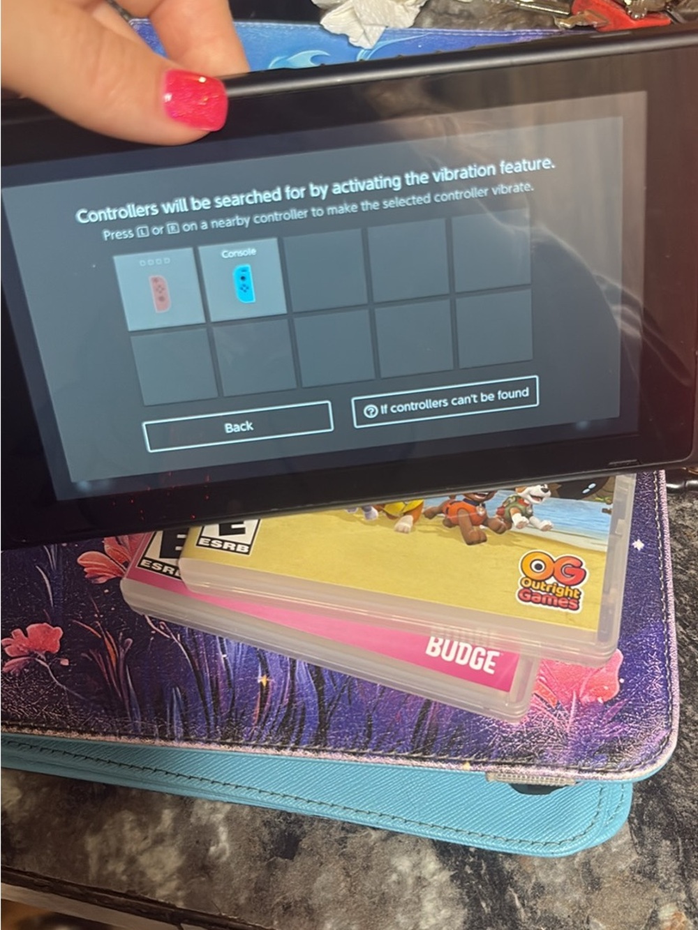 Nintendo Switch Console with Pink Left Joy-Con Visible